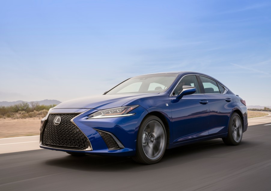 A bright blue Lexus ES 350 in drive mode.