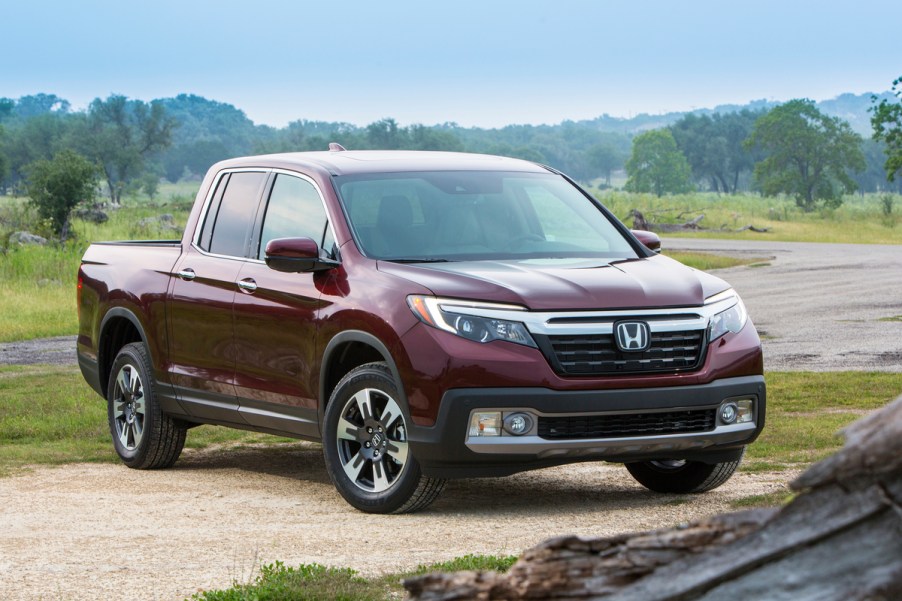 2019 Honda Ridgeline parked in sand near stream for off-roading