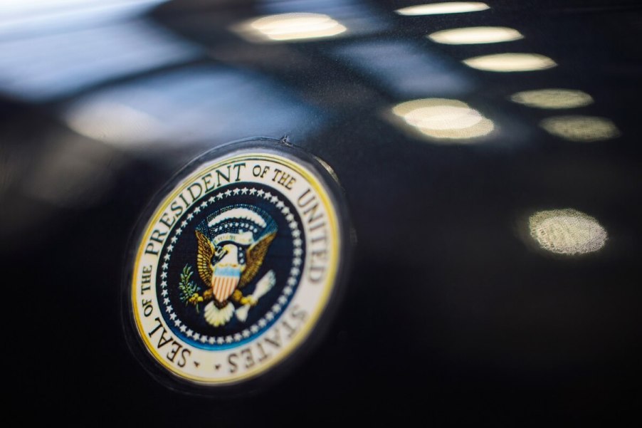 A replica of the JFK car, a Lincoln Continental, shows off its presidential seal.