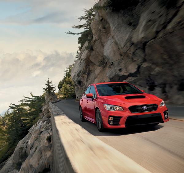 2020 Subaru WRX driving on a canyon road.