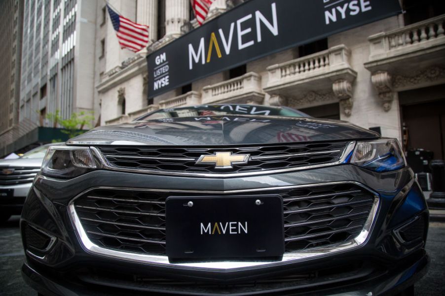 A GM Maven car-sharing service vehicle in front of the New York Stock Exchange