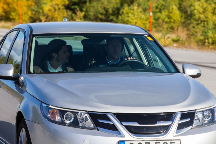 A silver car on a test drive