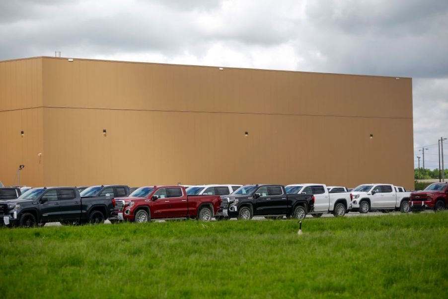 A parking lot with multiple new Chevy Silverados