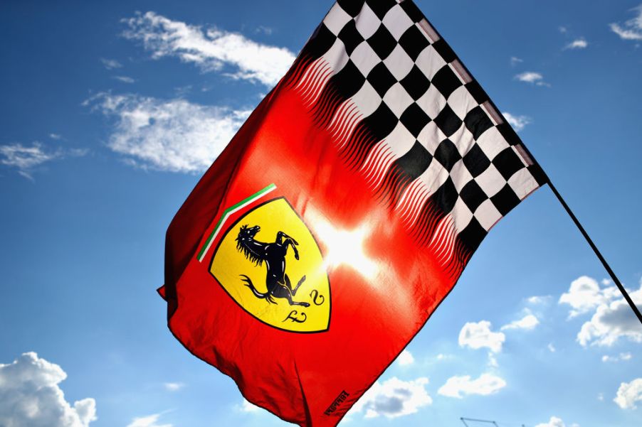 Ferrari logo on a flag flying in the wind.