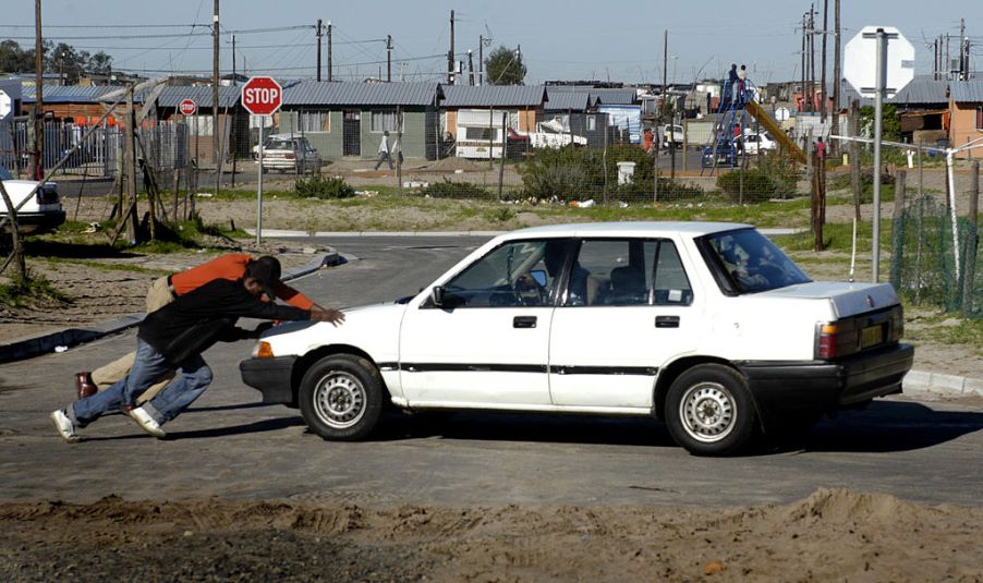 Men Pushing Car