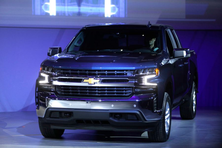 A Chevy Silverado 1500 pickup truck on display at an auto show.