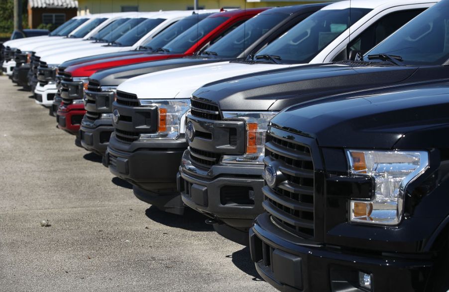 A lineup of Ford truck in all different colors.