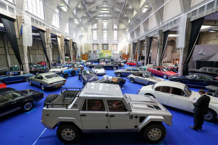 A Lamborghini LM02 truck on display at an auction house.