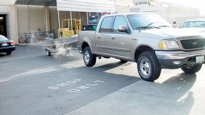 A full-size pickup truck towing a boat