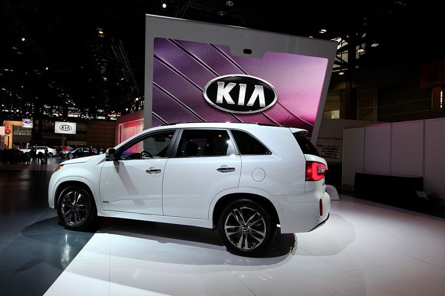 A white Kia Sorento on display during an auto show