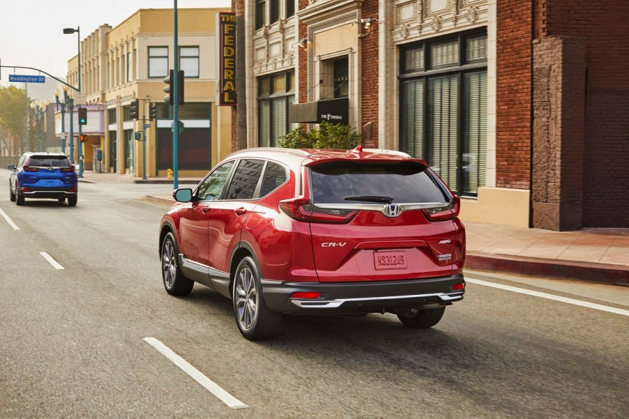 2020 Honda CR-V Hybrid in red driving on the road