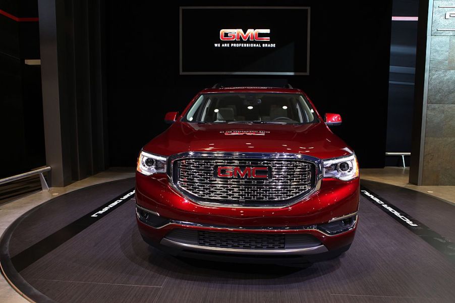 A red GMC Acadia on display