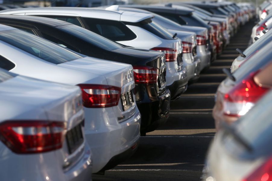 An assortment of new cars parked in a dealership lot.