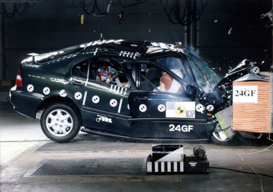 A Honda Civic slamming into a wall during a crash test