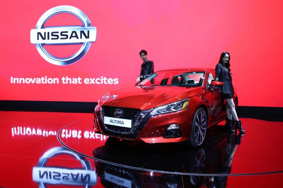 Models pose next to a NISSAN Altima at the Seoul Motor Show 2019 at KINTEX on March 28, 2019