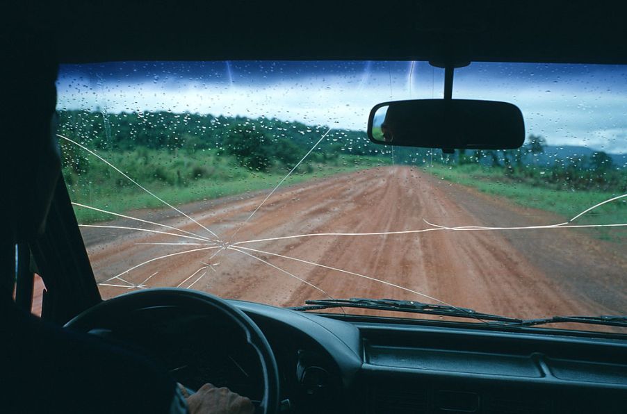 The view inside a car with a cracked windshield