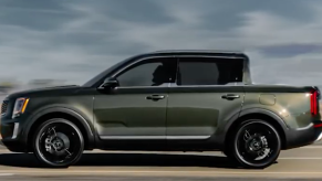 rendering of a Kia Telluride Pickup Truck at speed int he desert