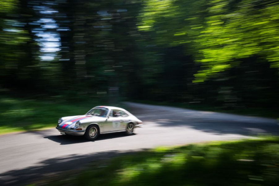 Severine Loeb and her copilot Denissa Fonjallaz are seen driving their Porsche 911 S on the road