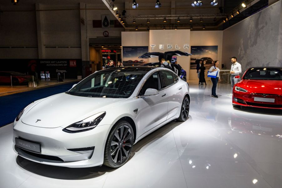 Tesla Model 3 compact sedan car in white on display at Brussels Expo