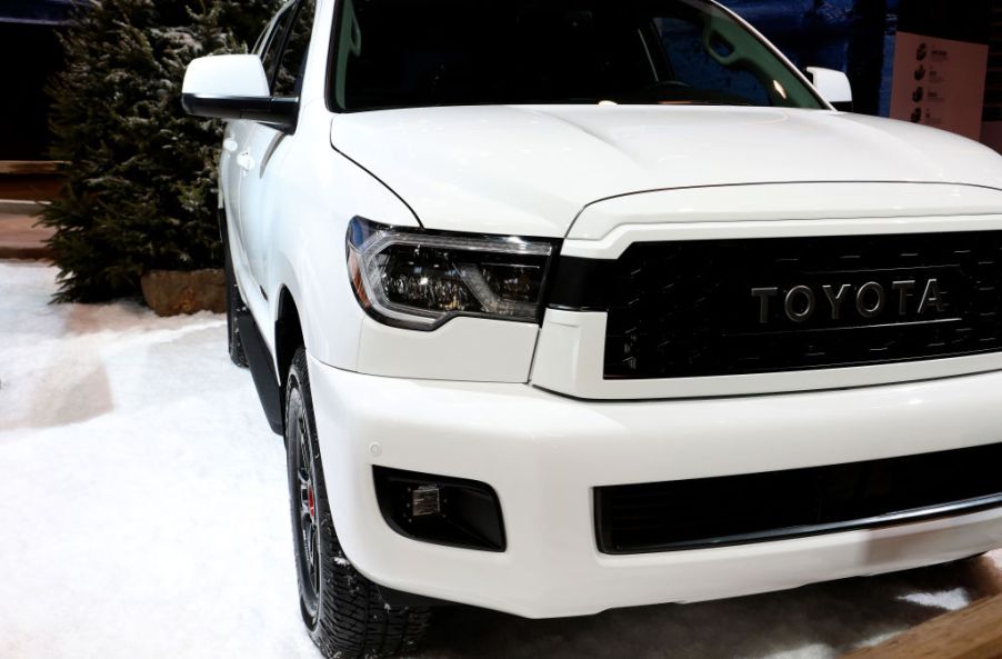 A white Toyota Sequoia on display at an auto show