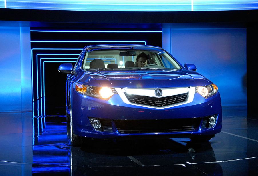 The 2009 Acura TSX , sporting the company's new grille design, is driven through a tunnel during its debut at the 2008 New York International Auto Show