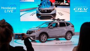 A 2020 Honda CR-V Hybrid on display at an auto show