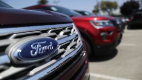 Two Ford Explorer SUVs parked in a lot