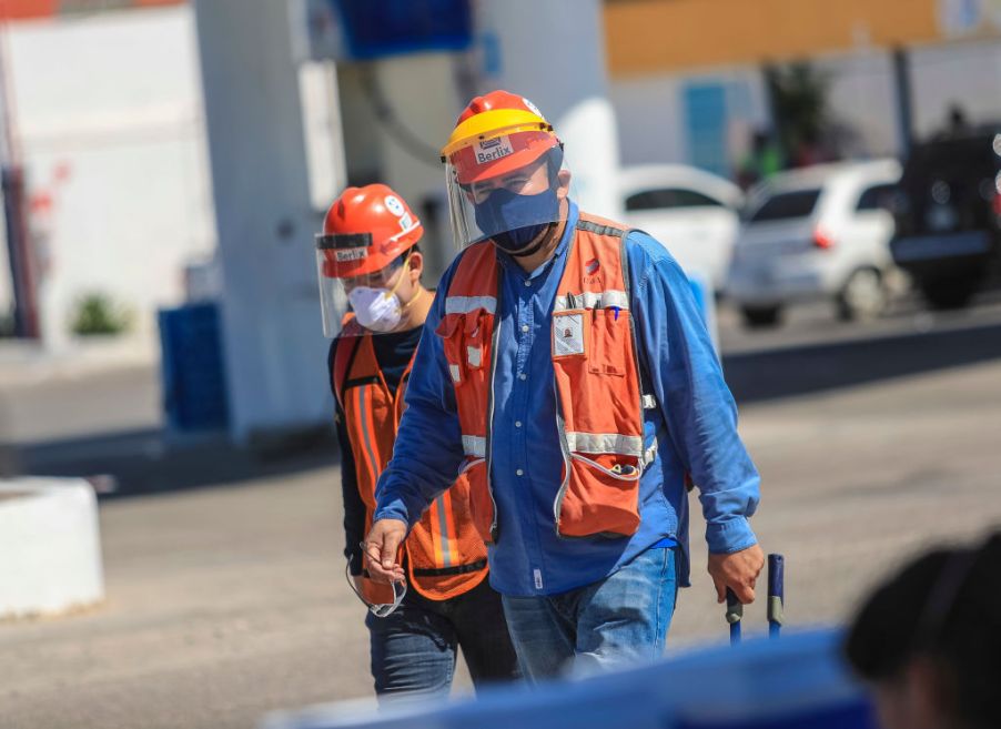 Ford employees walking into work with masks on