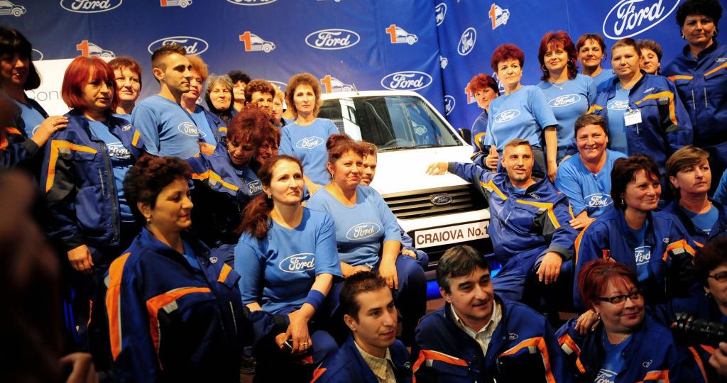 Ford workers in Romania pose with Transit van