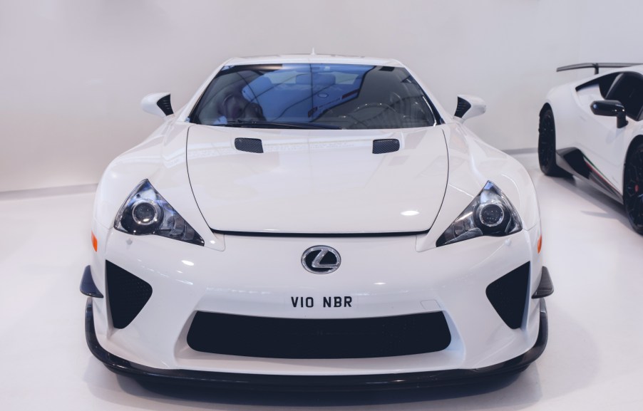 A white Lexus LFA on display at an auto show