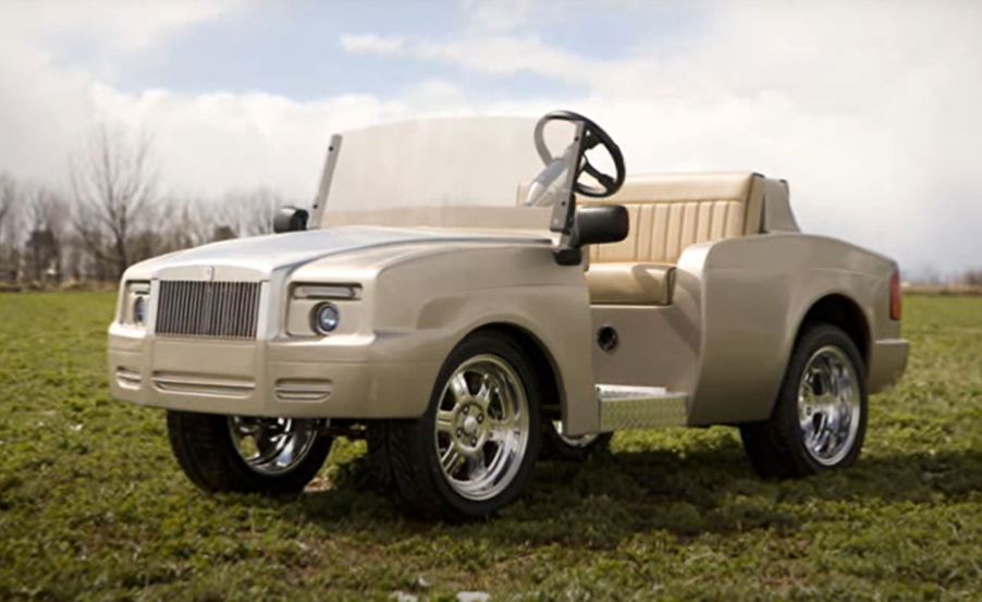 A custom gold colored Rolls-Royce Shadow golf cart