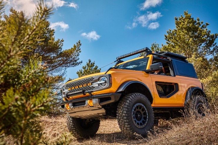 A yellow two-door Ford Bronco