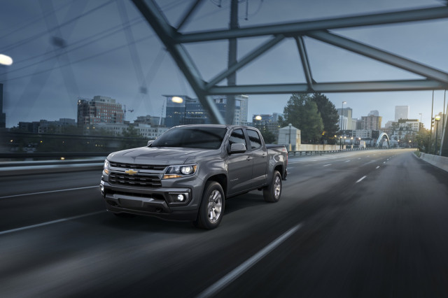 Chevy Colorado with sand dune color, driving on the road