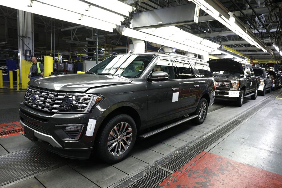 Factory workers assemble Ford Expeditions