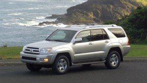 2004 Toyota 4Runner parked by the ocean and overlooking mountains