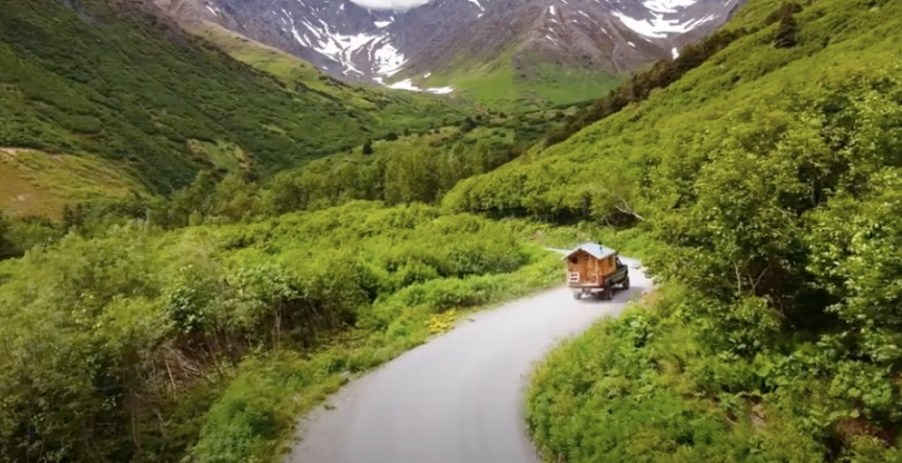 Timmy's truck camper driving on an epic Alaskan road