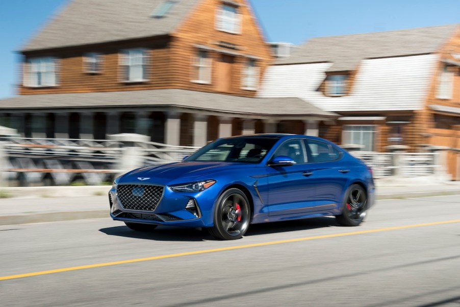 Genesis G70 driving through a city