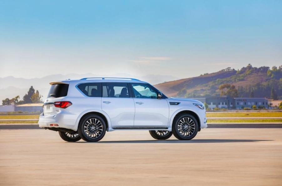 A white Infiniti QX80 on the track.