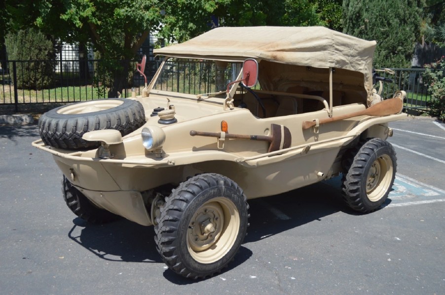 A tan 1944 Volkswagen Type 166 Schwimmwagen with its fabric roof up