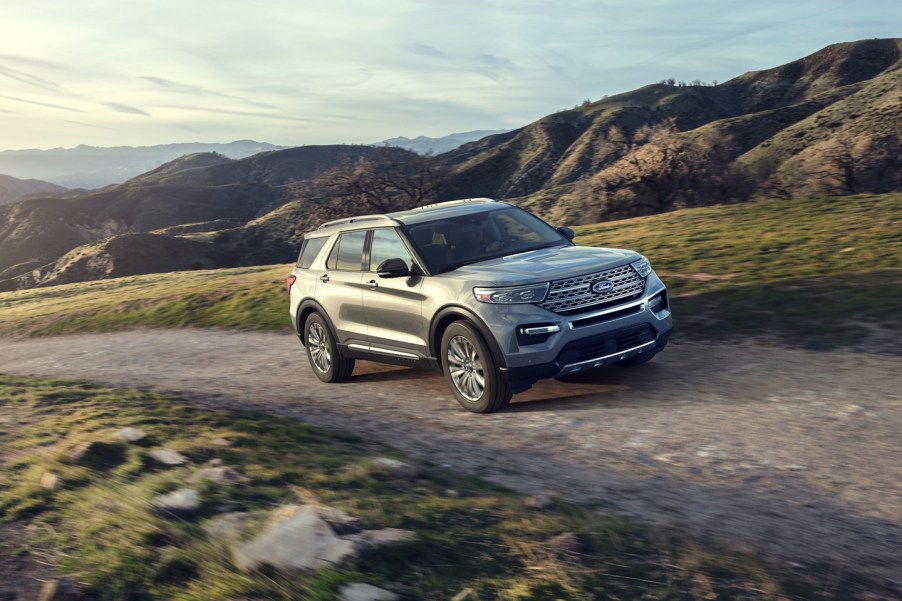 A 2020 Ford Explorer driving up a gravel road