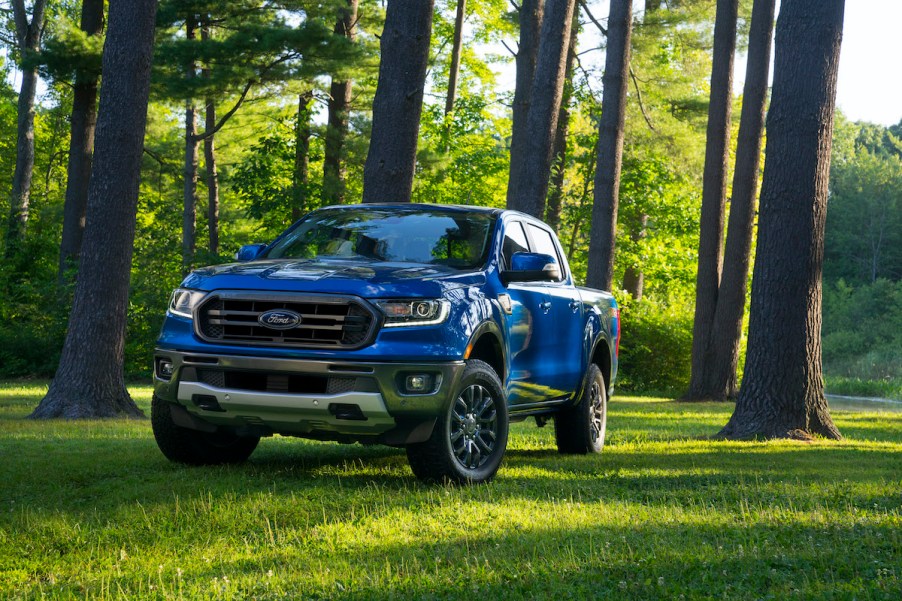 2020 Ford Ranger driving in the forest with lush green grass