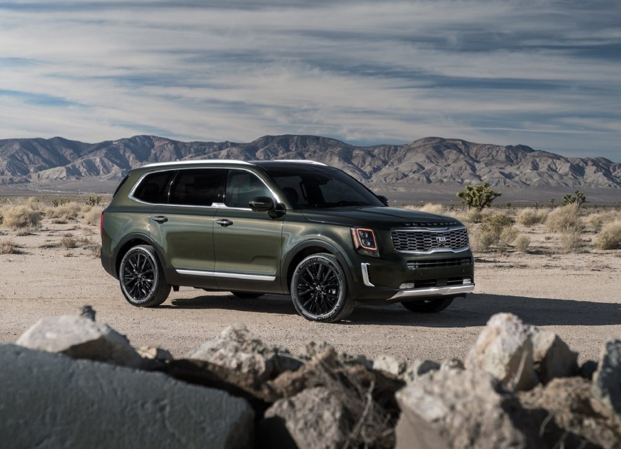 A dark-green 2020 Kia Telluride in the desert