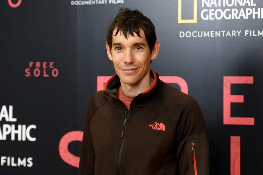 Alex Honnold posing for a photo at the premiere of a documentary