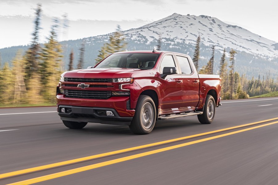 Chevrolet Silverado Diesel driving on a highway near a mountain