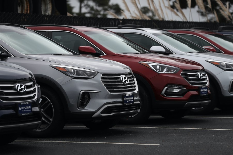 Row of Hyundai Santa Fe models outside a dealership