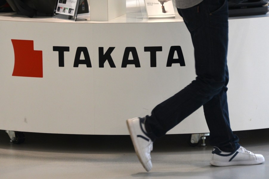 Takata airbags logo with someone walking by