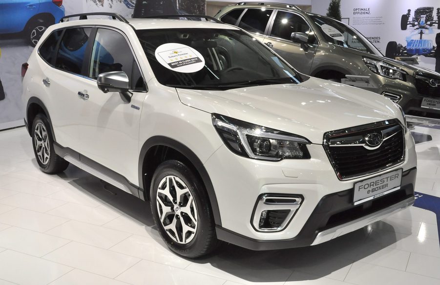 A white Subaru Forester on display at an auto show