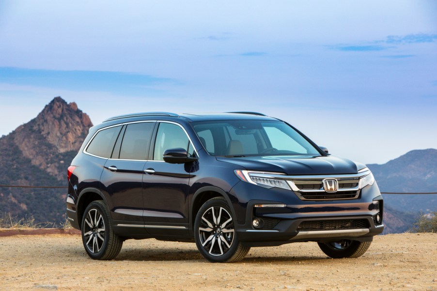 A blue Honda Pilot SUV outdoors.