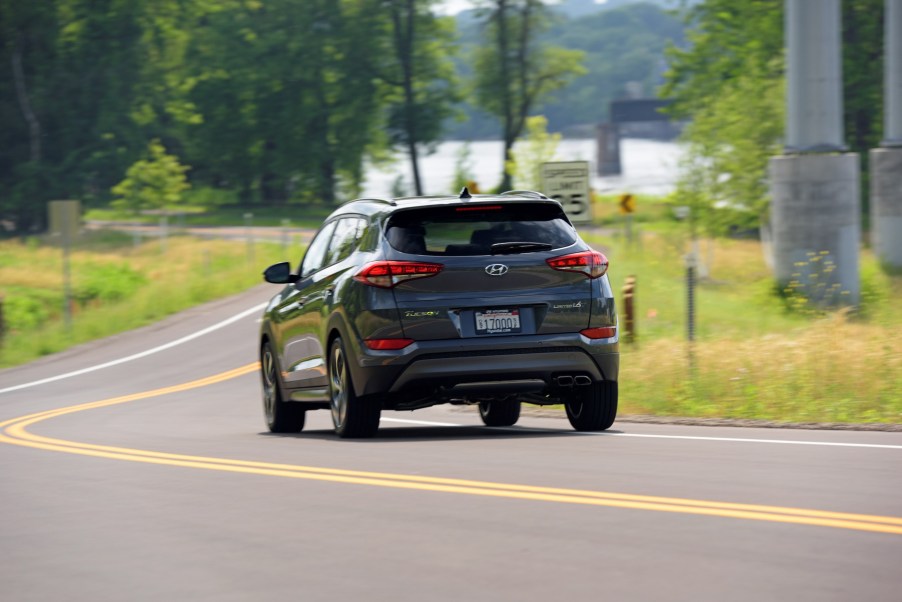 The 2017 Hyundai Tucson driving down a winding road.