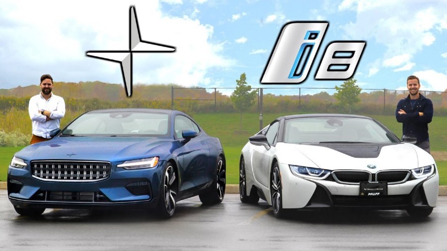 A blue 2021 Polestar 1 next to a white 2020 BMW i8 Roadster